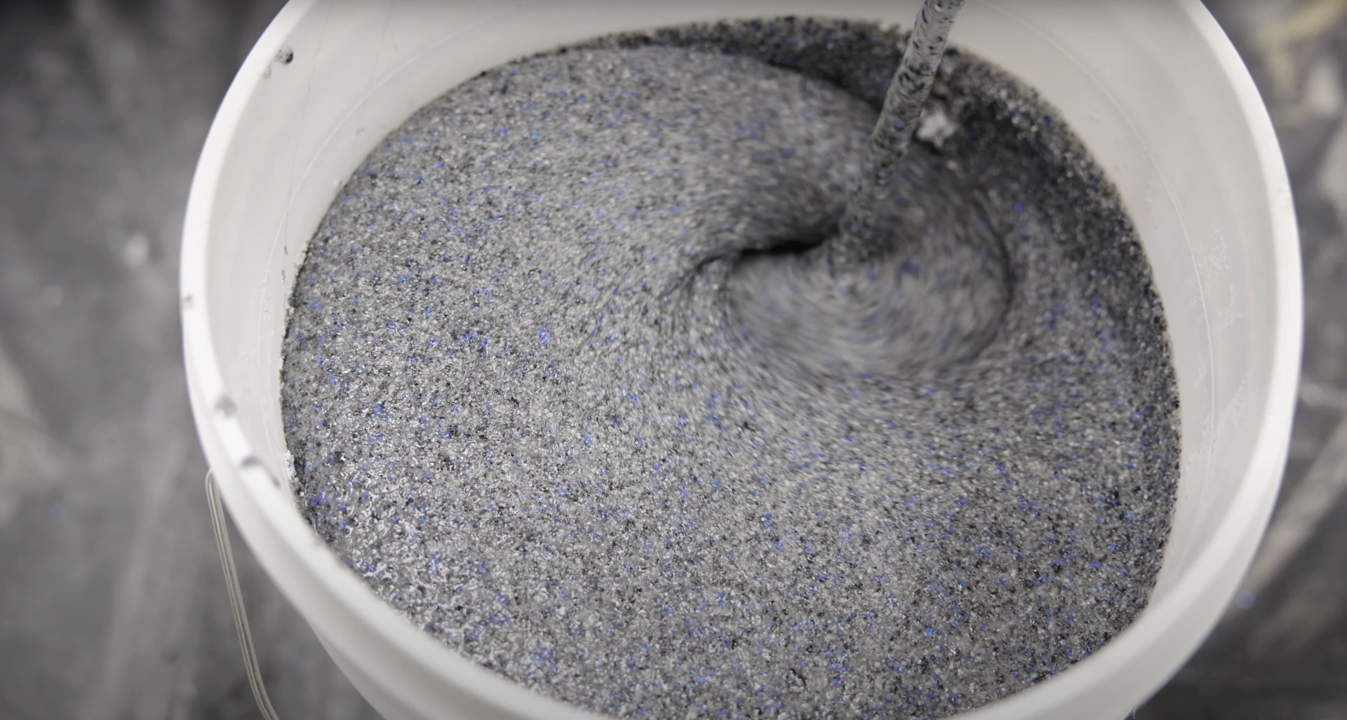 Close-up view of concrete mixing process showing proper consistency