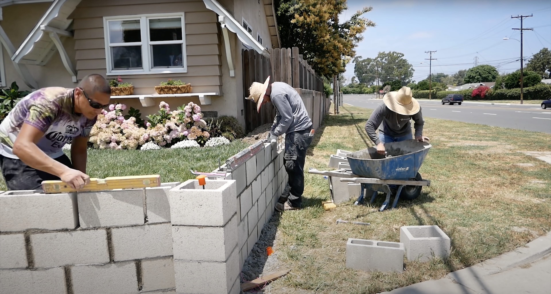 Concrete construction crew installing decorative concrete patio